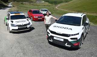 Auto Express consumer reporter Tom Jervis standing with a selection of Skoda vRS cars